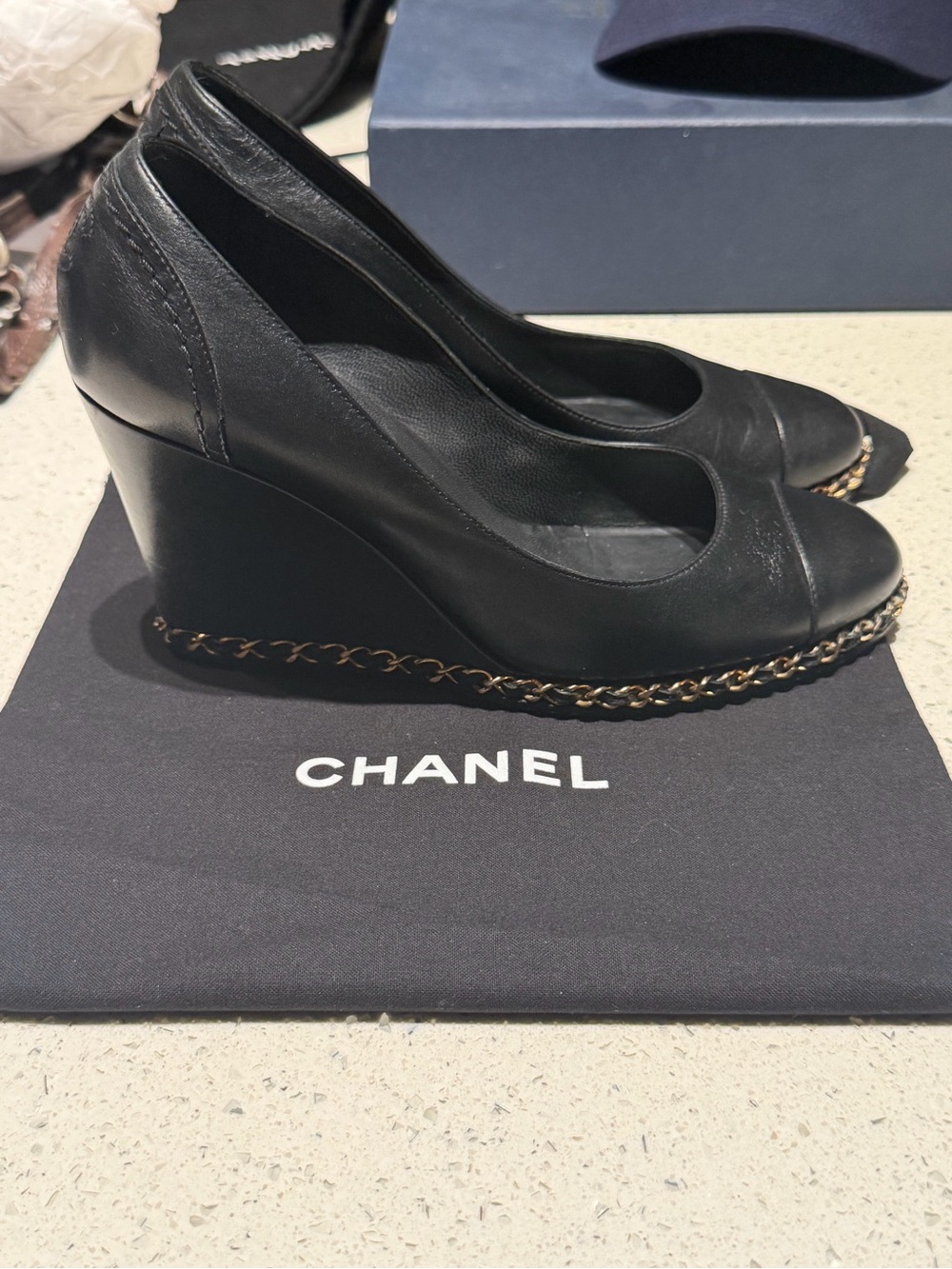 CHANEL Black Leather Wedge Pumps with Gold Chain Detail